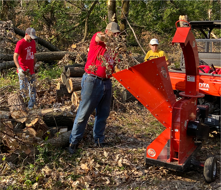 Rinderknecht employees volunteering with tree clean up